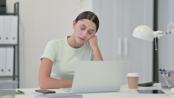 Tired Young Latin Woman Sleeping in Office 