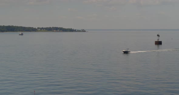 Forward Aerial Pan of a Speed Boat in Cold Spring Harbor Long Island