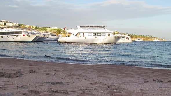 Pleasure Boats Arrive at the Pier on the Beach in Egypt. TimeLapse