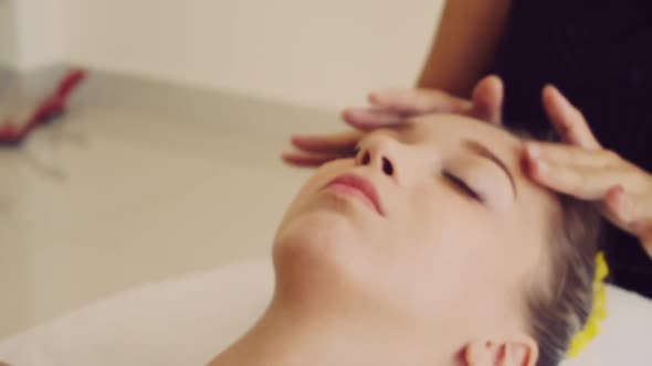 Woman Gets Facial and Head Massage in Luxury Spa