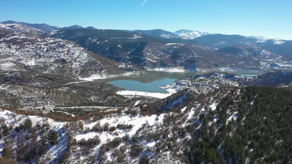 Aerial view of lake and trees on a winter day