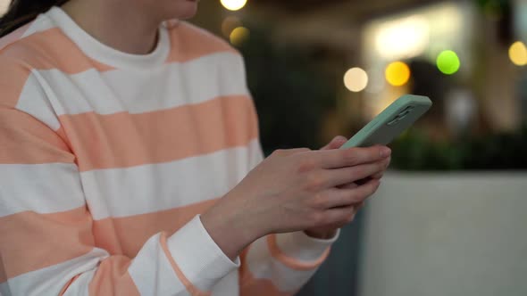 Focus on Female Hand Using Smartphone and Posting Social Media