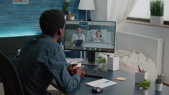 Worried Dad for Her Little Girl in Hospital Ward Talking on Video Conference Call