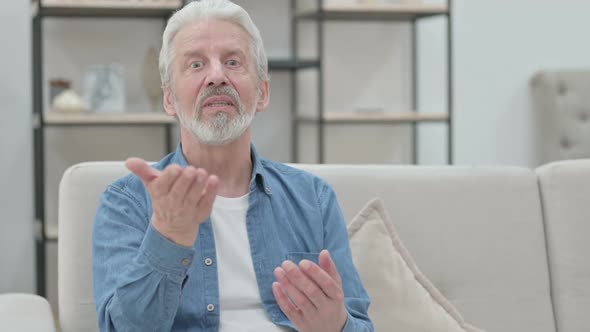 Old Man Doing Video Chat While Sitting on Sofa