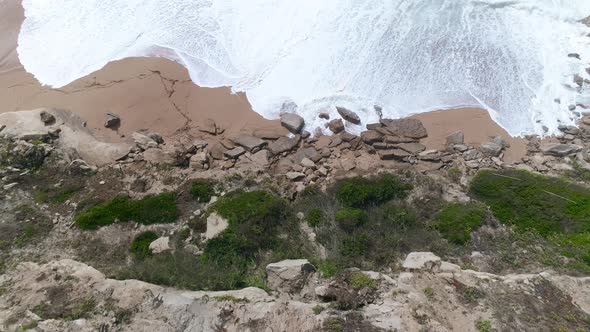 Aerial View of the Mediterranean Coast Waves Reach the Deserted Sandy Beach