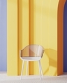 Stylish chair with transparent plastic back with yellow arch and blue wall on background - PhotoDune Item for Sale