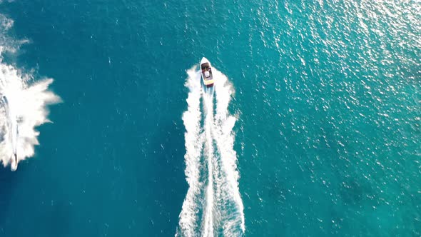 Aerial View of a Motor Boat Towing a Water Skier. Elounda, Crete, Greece