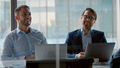 Applauding colleagues for corporate leader in meeting room. Two business partners communicating - PhotoDune Item for Sale