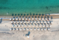 Greece, sandy beach, aerial view. People swim and relax at Chalkidiki. Sunny summer day - PhotoDune Item for Sale