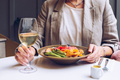 Close up of woman hands while she enjoying her lunch in cafe. - PhotoDune Item for Sale