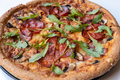 Close up salami pizza with mushrooms and arugula leaves. - PhotoDune Item for Sale