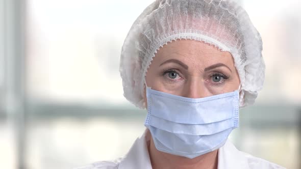 Face of Woman Surgeon in Face Mask.