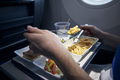Passenger eating airline meal - PhotoDune Item for Sale