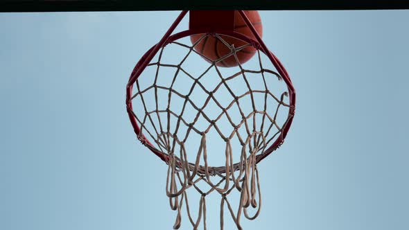 Basketball Ball Hits the Ring Goal