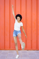 Glad black woman with raised leg - PhotoDune Item for Sale