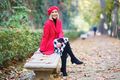 Smiling woman sitting on bench in autumn park - PhotoDune Item for Sale