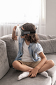 happy little boy child using virtual reality headset vr glasses gesturing at home having fun - PhotoDune Item for Sale