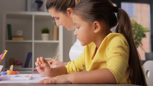 Mother with Little Daughter Drawing at Home