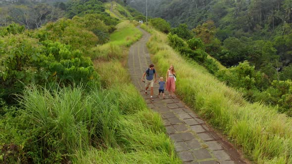 Aerial Shot of a Family Walking on the Artists Walk - Campuhan Ridge Walk in the Ubud Village 