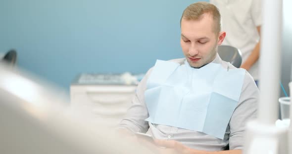 Man Waiting for the Doctor at the Dental Office