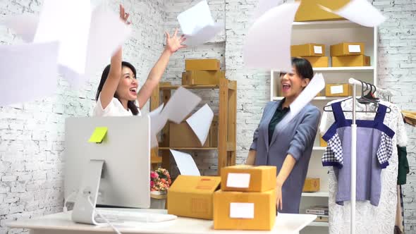 Happy Young Women Throwing Paper Document Pages