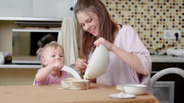 Little Cute Funny Girl Helping Mother Prepare Pie Cake in Kitchen Baking Homemade Cookie Together