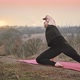 Young Woman Stretching in Nature - VideoHive Item for Sale