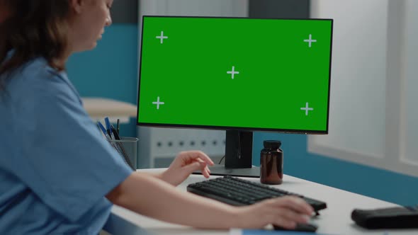 Close Up of Woman Nurse Looking at Horizontal Green Screen