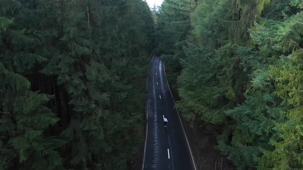 Aerial view of a person skating along the road at The Ardennes, Belgium.