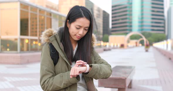 Woman using smart watch at outdoor