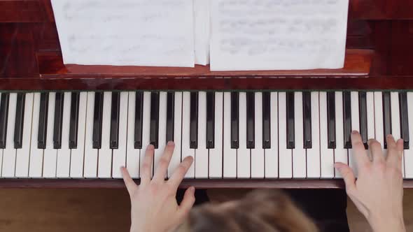 Female Piano Player View From the Top Body and Buttons of the Piano Were Digitally Modified