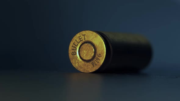 Close-up of falling 9mm bullet shells. Military, crime, weapon concept.