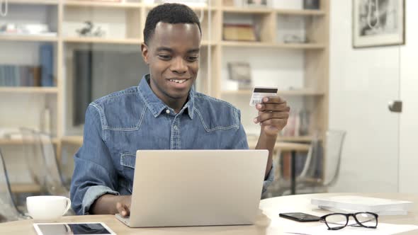 Online Shopping with Credit Card by Afro-American Designer