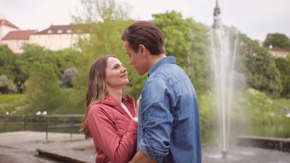 Young, happy, loving couple having date in the park. Relations, friendship and love concept.