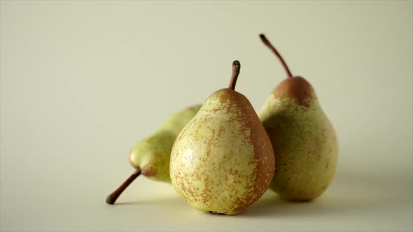 Ripe single pears on gray background