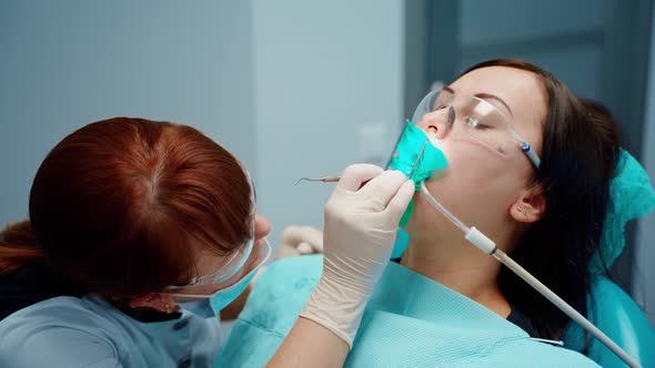 Woman in chair at stomatology clinic