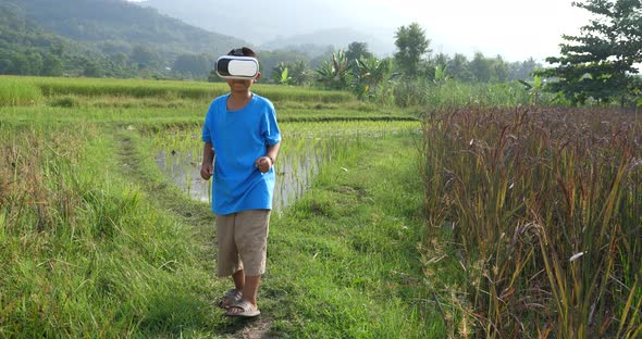 Rural Boy Dancing With VR Glasses