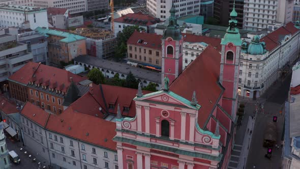 Exterior Of The Franciscan Church Of The Annunciation In Ljubljana, Slovenia At Sunset. aerial drone