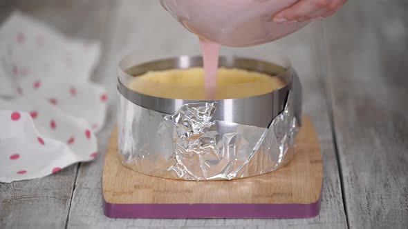 Woman Pastry Chef Prepares Berry Mousse Cake in the Kitchen