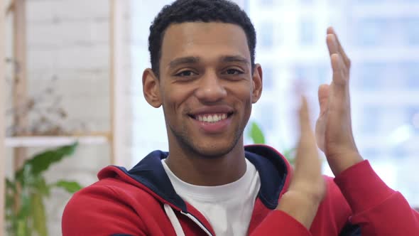 Portrait of Applauding Handsome AfroAmerican Man Clapping