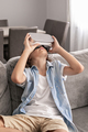 happy little boy child using virtual reality headset vr glasses gesturing at home having fun - PhotoDune Item for Sale