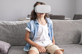 portrait of happy little boy child using virtual reality headset vr glasses gesturing at home fun - PhotoDune Item for Sale