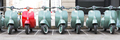 Vintage moped scooter in row on a parking of the city. - PhotoDune Item for Sale