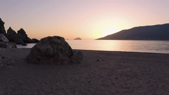 Beautiful Sunset Over Sea and Sandy Beach on Tropical Island