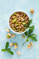 Pistachios. Pistachio nuts with green leaves. Healthy natural vegetarian organic food - PhotoDune Item for Sale