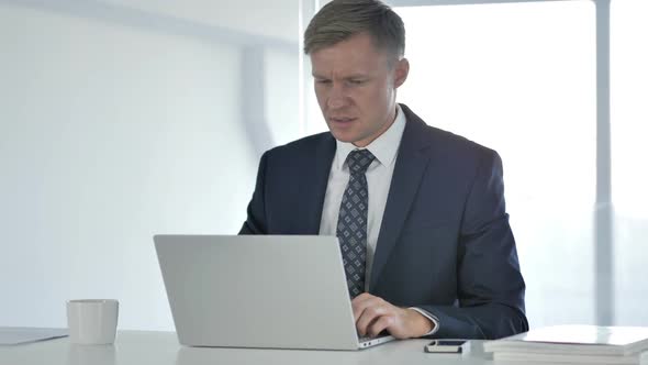 Loss Frustrated Businessman Working on Laptop