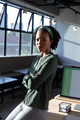 Portrait of confident african american young businesswoman with arms crossed in office - PhotoDune Item for Sale