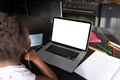African american girl wearing headphones attending online lecture over laptop on table at home - PhotoDune Item for Sale