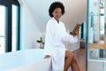 Portrait of confident young afro african american woman with digital tablet in bathroom, copy space - PhotoDune Item for Sale