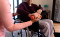 Mid section of female physiotherapist helping caucasian senior man to do exercise with dumbbells - PhotoDune Item for Sale